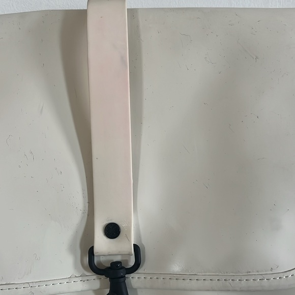 RAINS Shield Rucksack is a clean and functional backpack. Elegant Cream Backpack - Picture 6 of 11